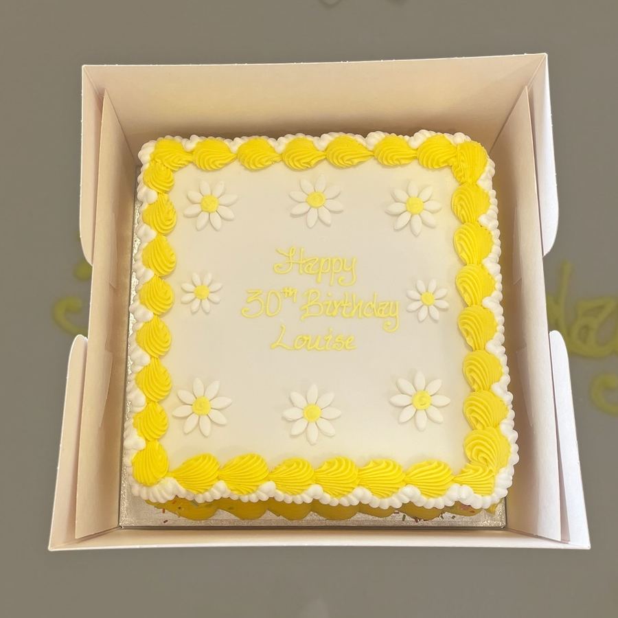Yellow daisy birthday cake