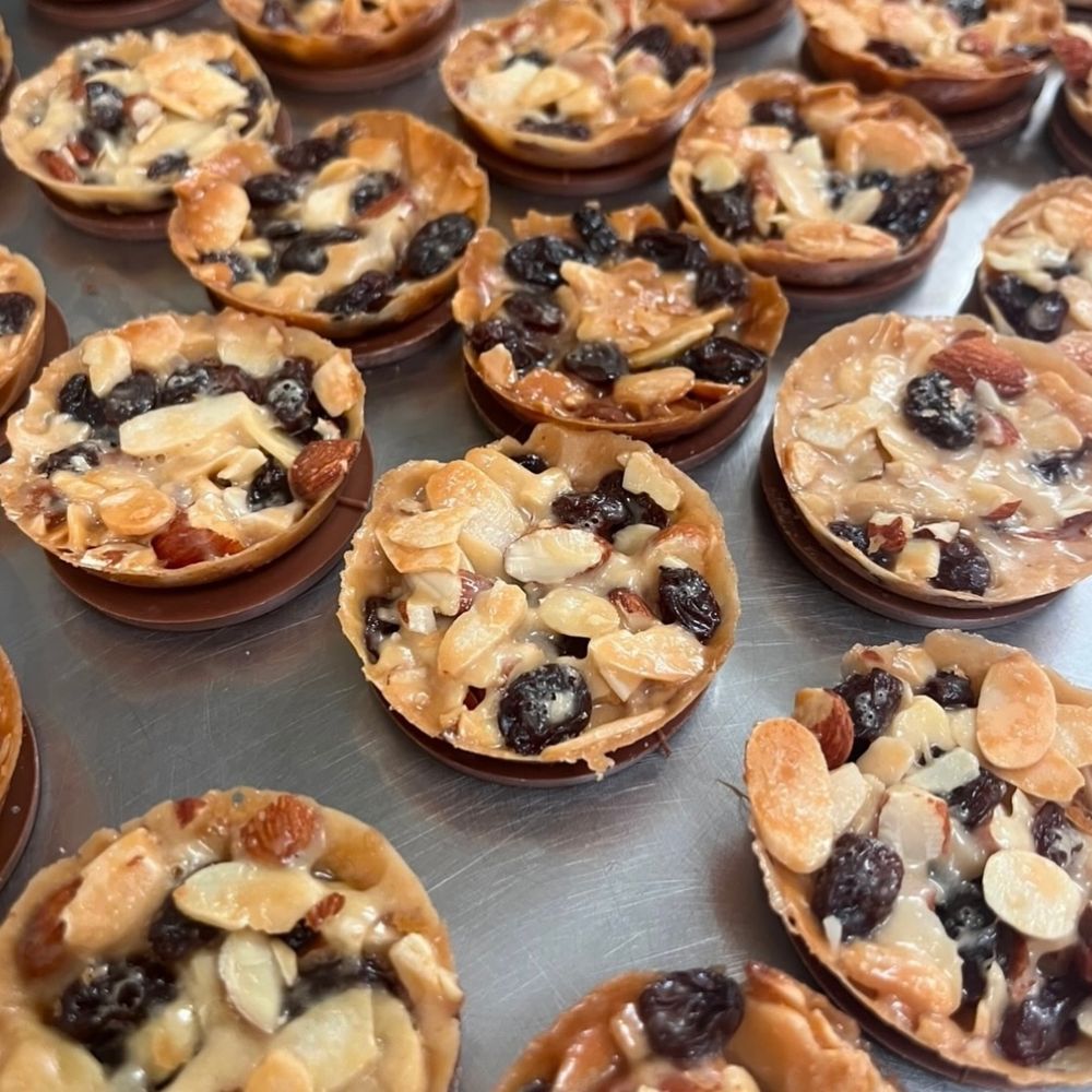 Florentines with almonds and raisins on a chocolate base