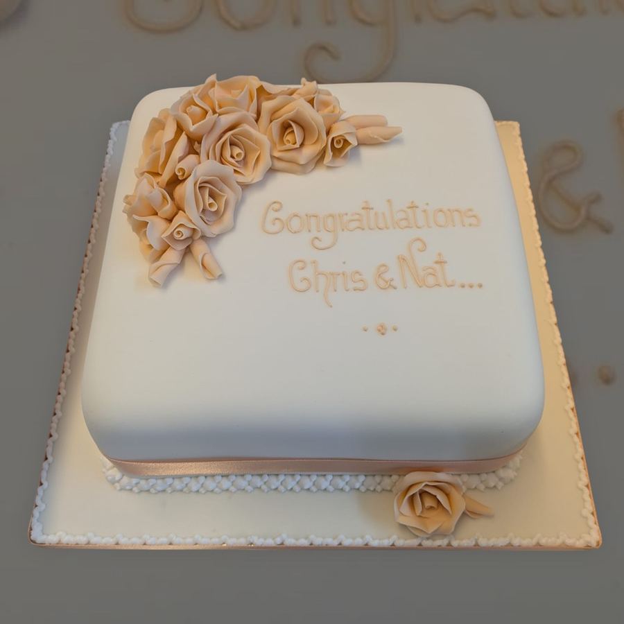 Square ivory celebration cake with sugar roses