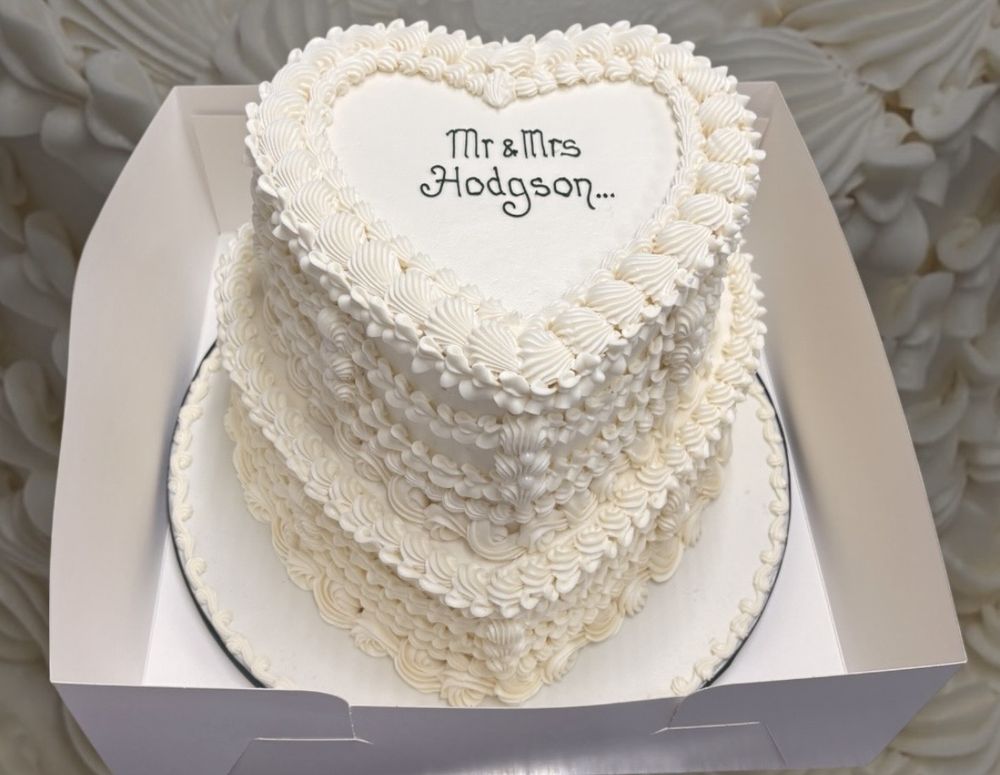 Two-tier white heart Lambeth wedding cake